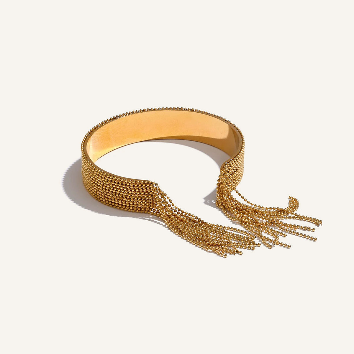 Cuff bracelet with chain tassels in gold tone – Charmhabit