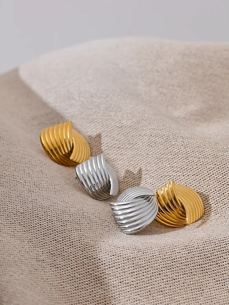 Stud earrings with ribbed loops in gold tone and silver tone, styled shot – Charmhabit