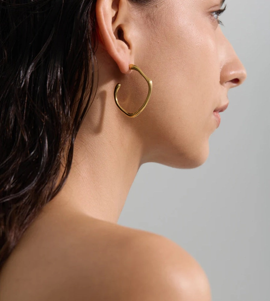 Open C-shaped earrings with a soft curve, worn, second image – Charmhabit