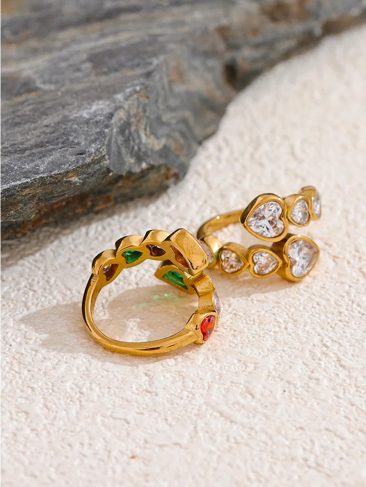 Open ring with cubic zirconia hearts, styled shot on grey stone – Charmhabit