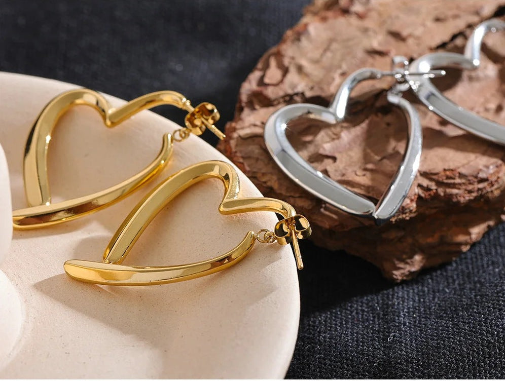 Open heart-shaped earrings with a high-gloss finish, styled shot – Charmhabit