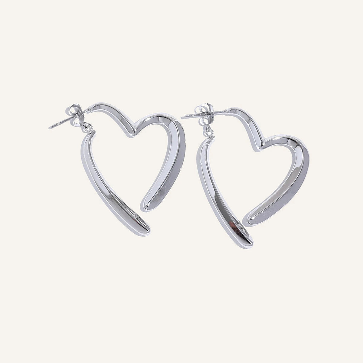 Open heart-shaped earrings with a high-gloss finish, silver tone, on a light background – Charmhabit