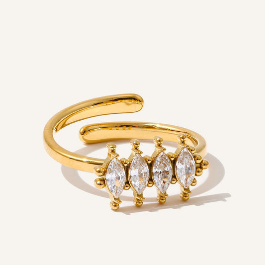 Open ring with marquise-cut cubic zirconia, gold tone, on a light background – Charmhabit