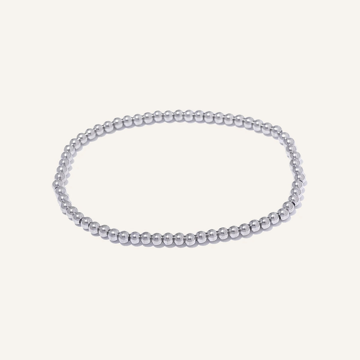 Bracelet élastique avec boules en acier, argenté 3 mm, sur fond clair – Charmhabit