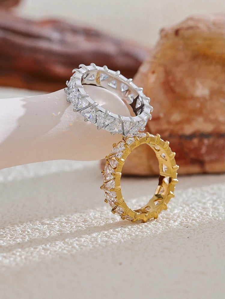 Ring with cubic zirconia hearts, silver tone and gold tone, styled shot on white – Charmhabit