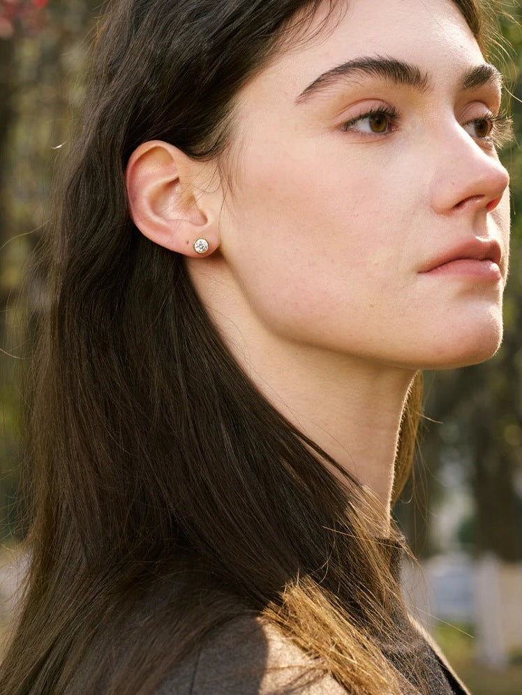 Round cubic zirconia stud earrings, worn from the side – Charmhabit