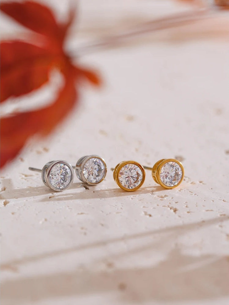 Round cubic zirconia stud earrings, in silver tone and gold tone, styled shot – Charmhabit