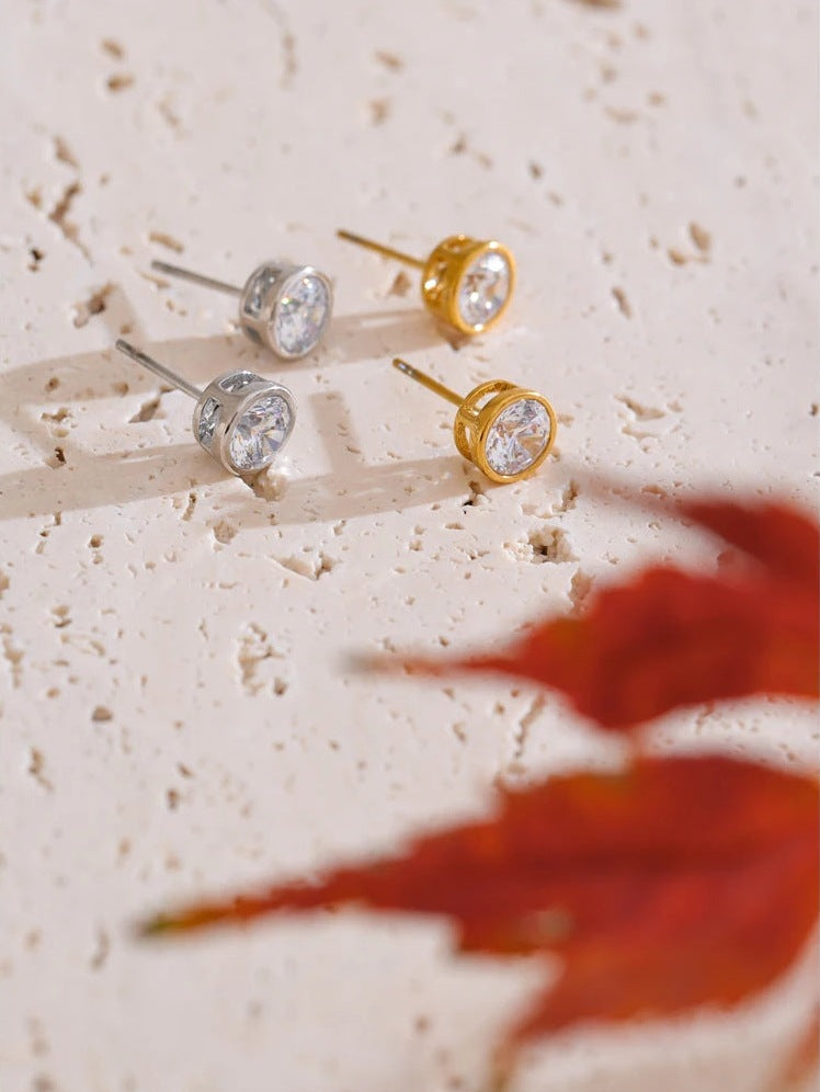 Round cubic zirconia stud earrings, in silver tone and gold tone on light stone – Charmhabit