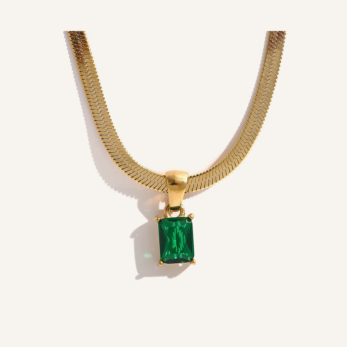 Snake chain with rectangular zirconia pendant, green, on a light background – Charmhabit