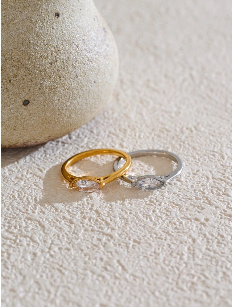 Marquise-cut cubic zirconia solitaire ring in gold and silver tones, styled shot – Charmhabit