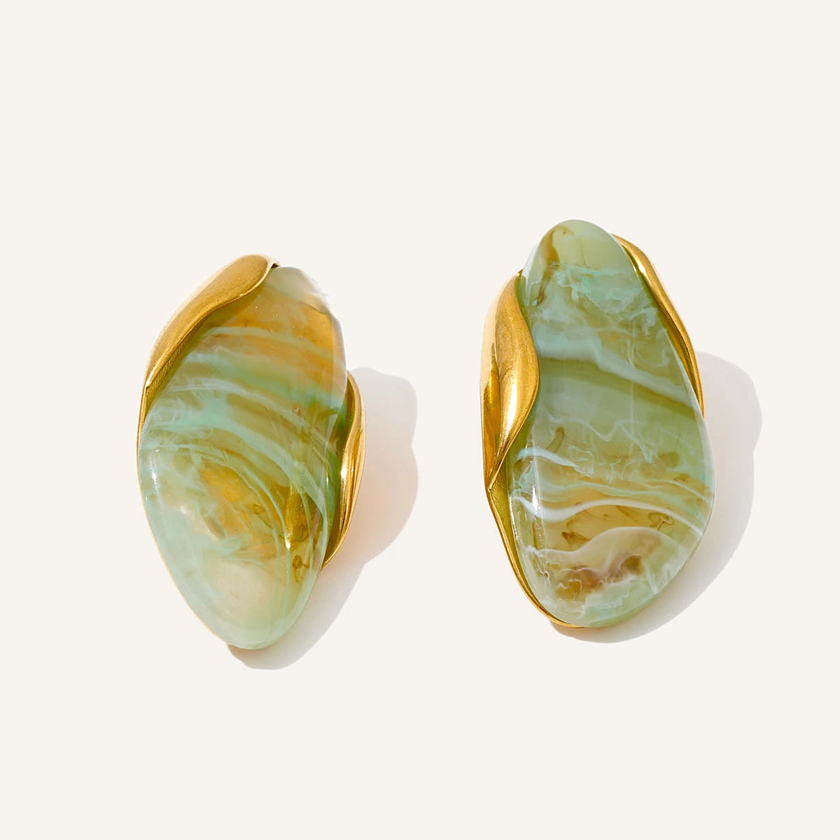 Statement resin stud earrings in jade green on a light background – Charmhabit