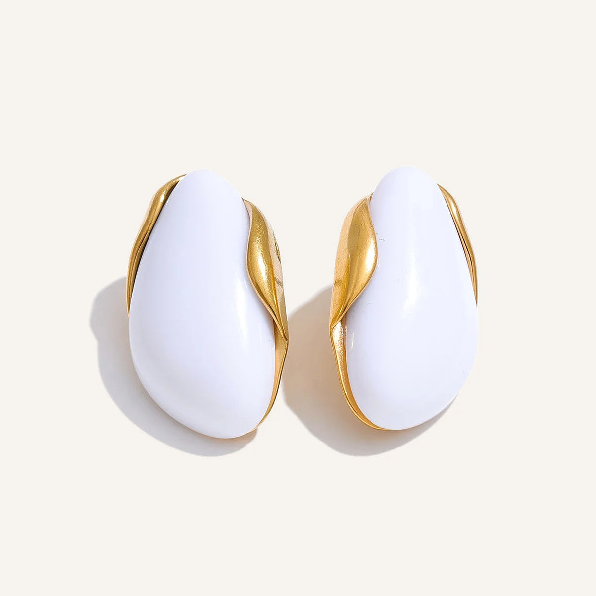 Statement resin stud earrings in white on a light background – Charmhabit