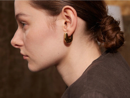 Sturdy U-shaped hoop earrings, gold tone, worn – Charmhabit