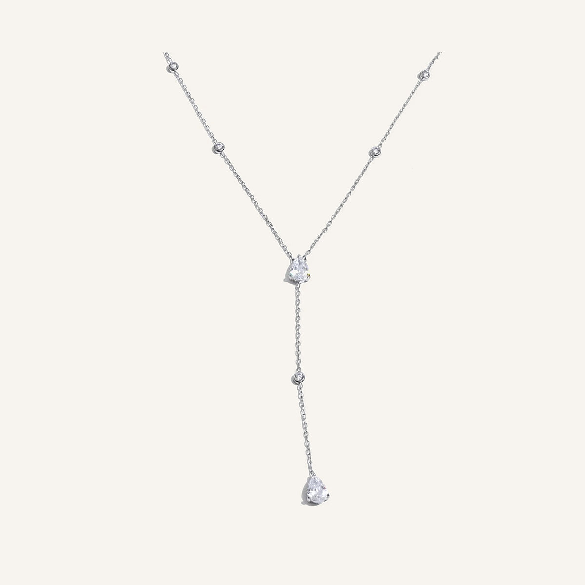 Y-necklace with drop pendant, silver tone, on a light background – Charmhabit